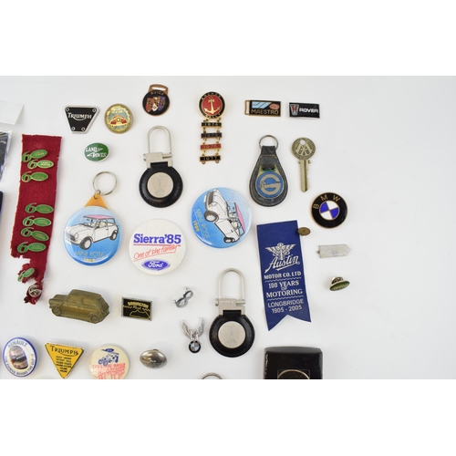 471 - A good quantity of automobilia items to include car badges, keyring, pin badges, AA keys, (small tra... 