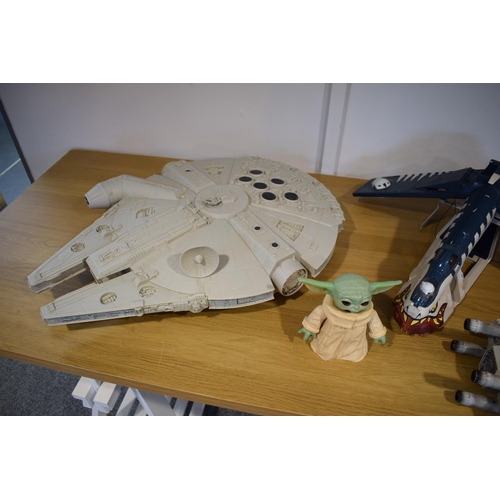 502 - A good quantity of Star Wars toys including X Wing Fighters, Yoda figure and various other related i... 