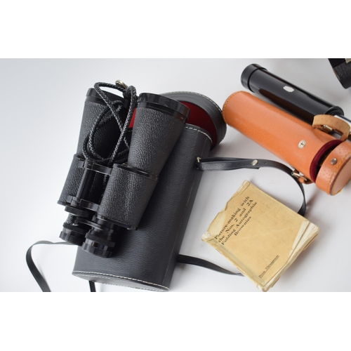 526 - A collection of optical equipment to include a pair of Zenith 10 x 50 binoculars in original case, a... 