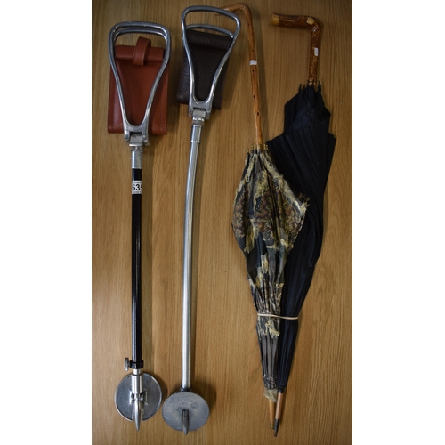 535 - A collection of sticks and parasols to include two shooting sticks with leather seat pads and alumin... 