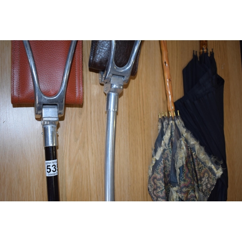 535 - A collection of sticks and parasols to include two shooting sticks with leather seat pads and alumin... 