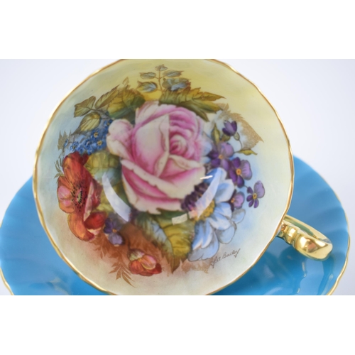 218 - Aynsley cup and saucer in the Pink Rose / Cabbage Rose design, signed by J A Bailey (2).