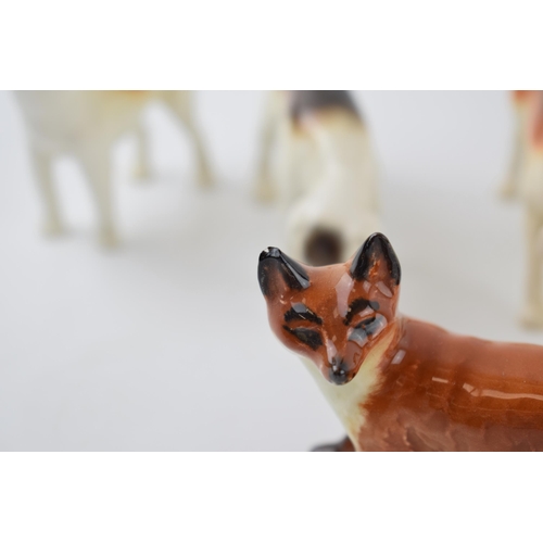 65D - Beswick to include a beagle, 4 various foxhounds and 2 foxes (7).