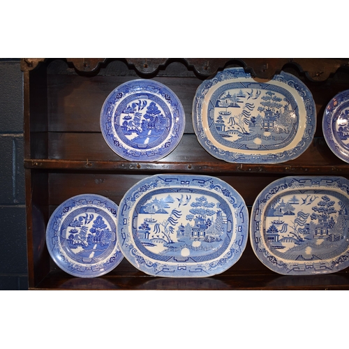 108A - A collection of 19th century and later blue and white pottery, in the Blue Willow pattern to include... 