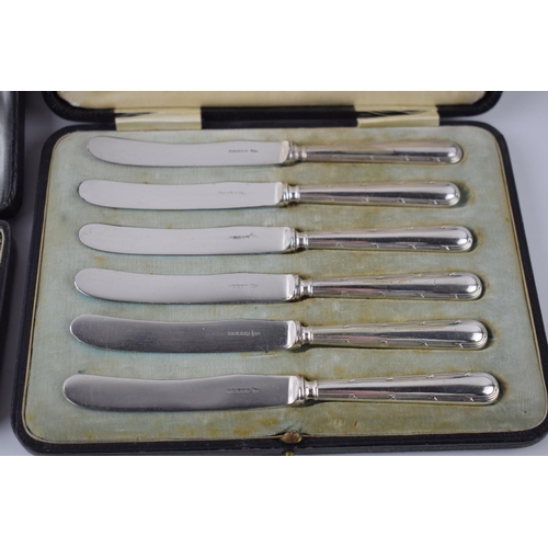 227A - A cased christening set to include a spoon and pusher, Birmingham 1921, 39.3 grams, with a set of 6 ... 