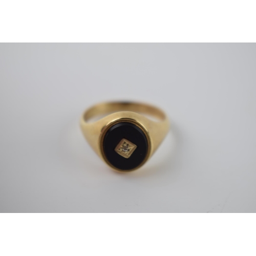 290 - 9ct gold and onyx ring set with diamond, 5.1 grams, size V.