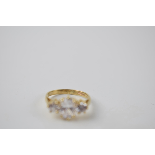 290F - 9ct gold three white stone dress ring, 2.5 grams, size K.