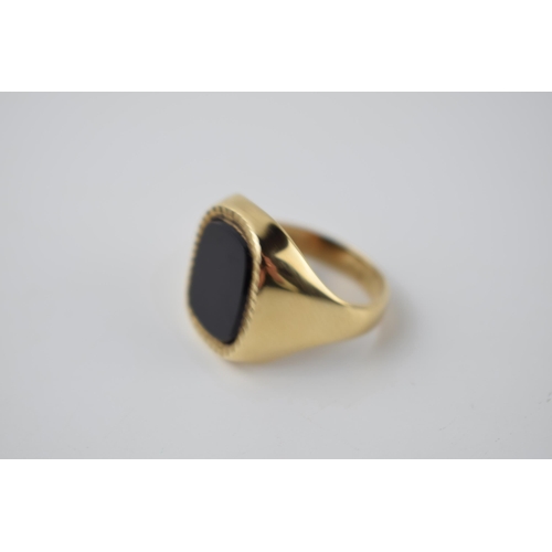 291 - 9ct gold and onyx gents ring with bright cut edge, 7.2 grams, size V.