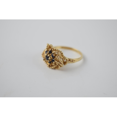 293 - 9ct gold sapphire dress ring with ornate setting, 3.5 grams, size M.