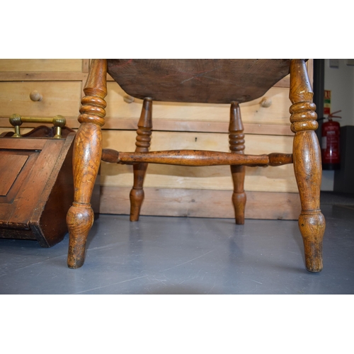 507 - Antique elm / ash captain's / smokers bow chair, 83cm tall.