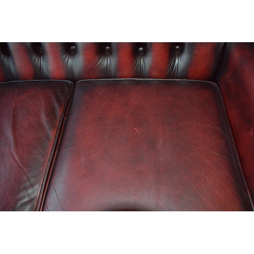 508 - Queen Anne revival chesterfield wingback three seater sofa, with high back, in red leather with butt... 