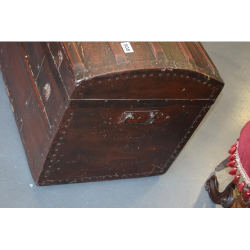 509 - Antique domed top travelling trunk, lined with wall paper, 87cm x 55cm.