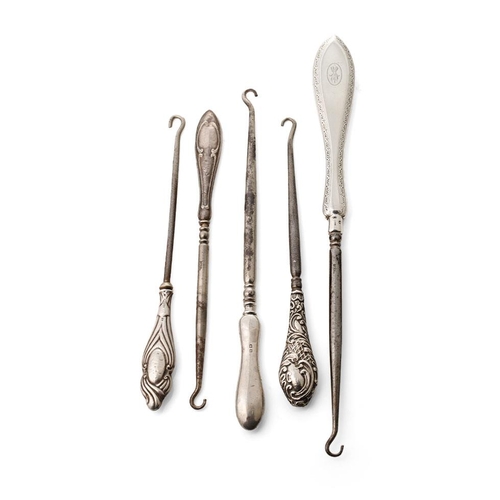 142 - A collection of silver handled button hooks, longest 24.5cm (5).