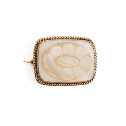 199 - Yellow metal brooch (tests as circa 18ct) with carved Mother of Pearl decoration in the form of a fl... 