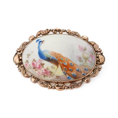 206 - C Gresley hand painted miniature oval brooch with a peacock amongst foliage, in 9ct gold mount, 60mm... 