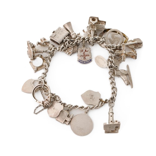 214 - Silver charm bracelet with various charms to include an ice skating boot, rings, a lighthouse and ot... 