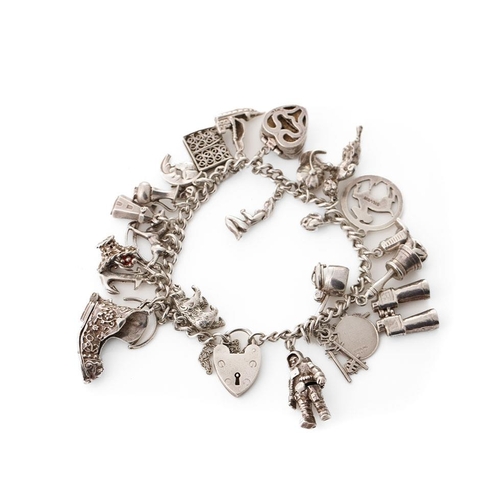 215 - Silver charm bracelet with various charms to include an astronaut, a pair of binoculars, a bell and ... 