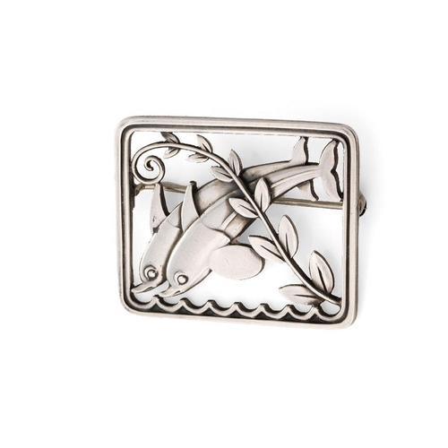 235 - A Georg Jensen silver brooch, designed by Arno Malinowski. 'Leaping Dolphins' in a rectangular frame... 