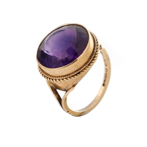 264 - 9ct gold ring set with circular purple stone, 5.2 grams, size M.