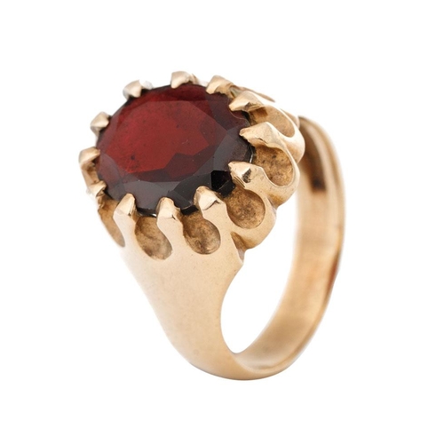 265 - 9ct gold gentlemans ring set with large faceted garnet, 6.9 grams, size P.