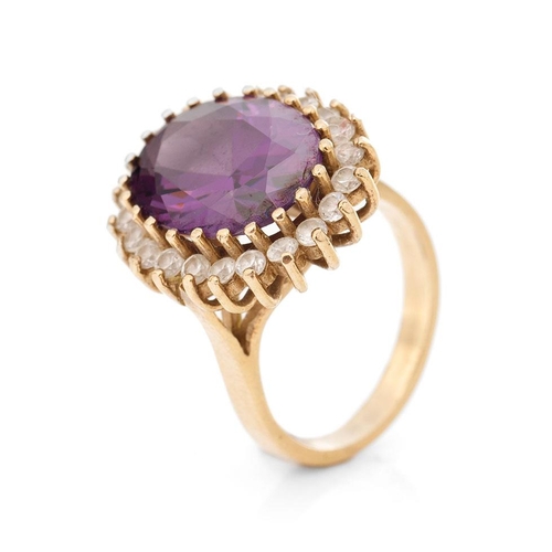 267 - 9ct gold ring set with CZs and a large amethyst style stone, 9.7 grams, size Q.