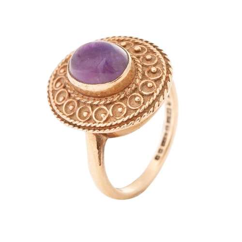 269 - 9ct gold ladies ring with ornate setting with polished cabachon stone, 5.9 grams, size M.