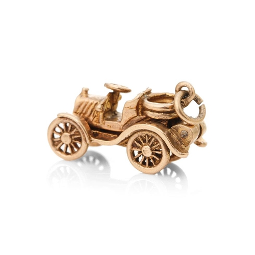 291 - 9ct gold charm in the form of an old fashioned car, 5.3 grams.