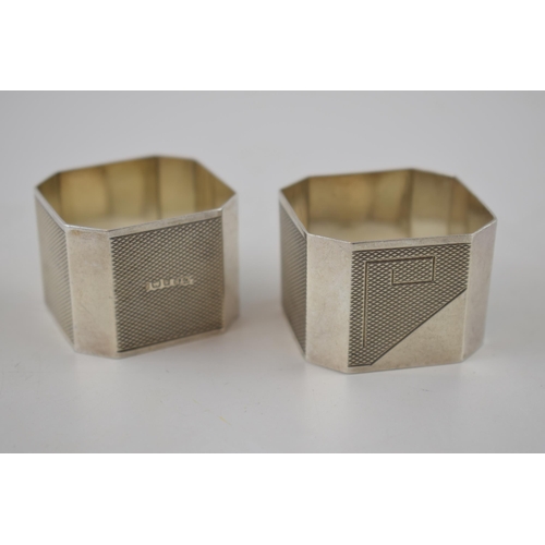 105 - A pair of silver Art Deco napkin rings, Birmingham 1934, C T B, 44.3 grams.