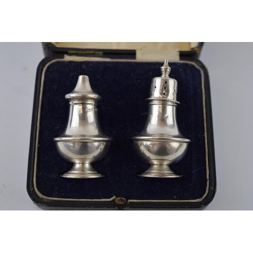 130 - Boxed pair of silver cruets, Birmingham 1919, H W Ltd, 27.3 grams.