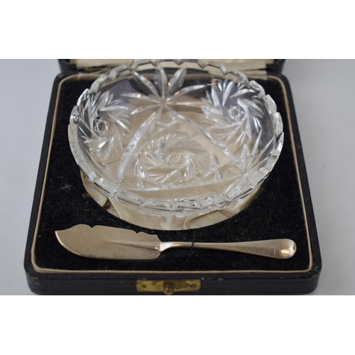 132 - Cased glass butter dish with a silver butter knife, London 1935.