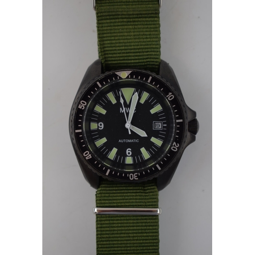 185 - MWC MIL DIVER Automatic date military style watch on green Nato style strap. Rotational bezel with l... 