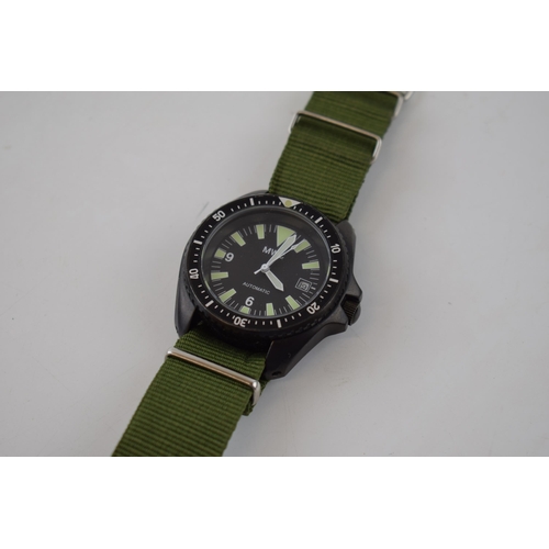 185 - MWC MIL DIVER Automatic date military style watch on green Nato style strap. Rotational bezel with l... 