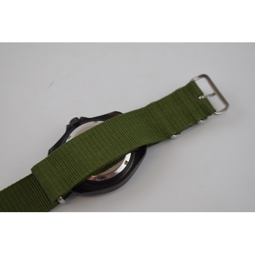 185 - MWC MIL DIVER Automatic date military style watch on green Nato style strap. Rotational bezel with l... 