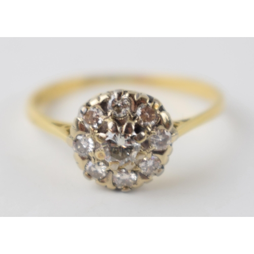 197 - 18ct gold and platinum daisy ring set with diamonds, approximately 0.38 carat of diamonds, UK size T... 