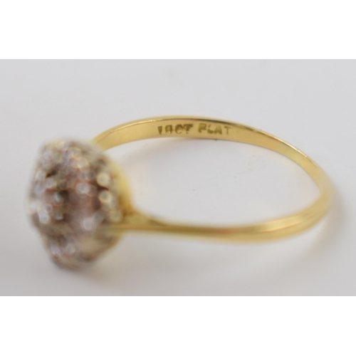 197 - 18ct gold and platinum daisy ring set with diamonds, approximately 0.38 carat of diamonds, UK size T... 