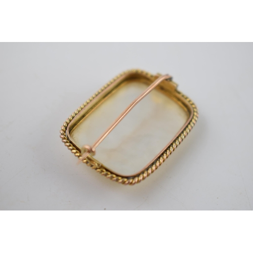 199 - Yellow metal brooch (tests as circa 18ct) with carved Mother of Pearl decoration in the form of a fl... 