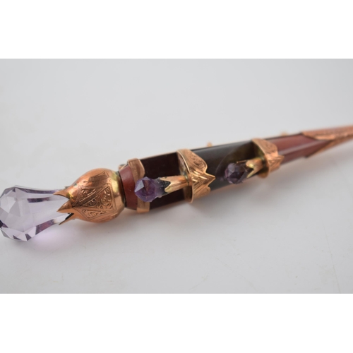 205 - Victorian 9ct gold sword brooch set with agate and amethysts, 85mm wide, 12.2 grams.