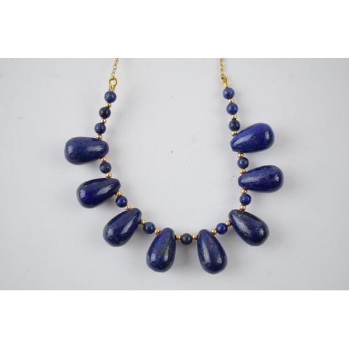 210 - 9ct gold necklace with lapis lazuli beads with 9ct beads inbetween, 55cm wide, gross weight 24.4 gra... 