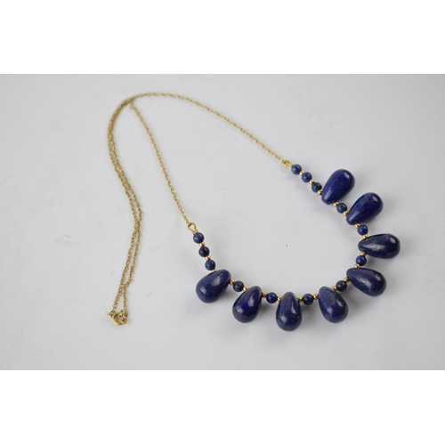 210 - 9ct gold necklace with lapis lazuli beads with 9ct beads inbetween, 55cm wide, gross weight 24.4 gra... 