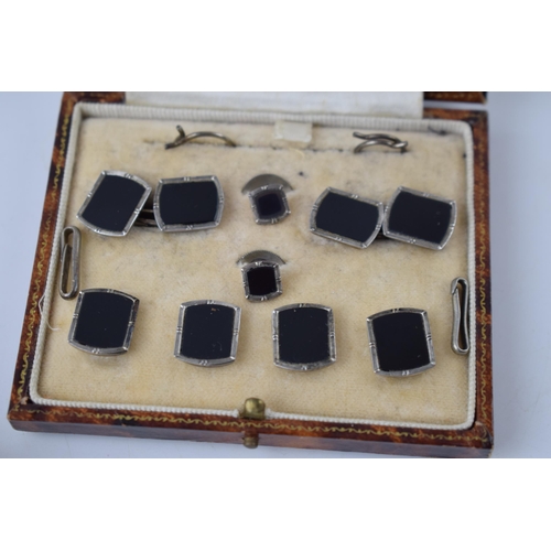 212 - A cased Art Deco / 1930s silver and onyx gentleman's cufflinks and stud set, with a simialr cased Au... 