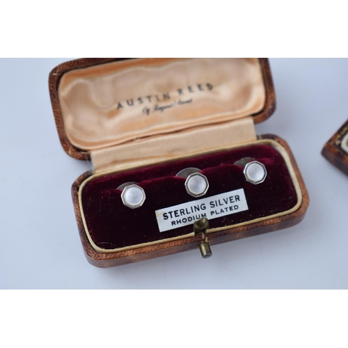 212 - A cased Art Deco / 1930s silver and onyx gentleman's cufflinks and stud set, with a simialr cased Au... 