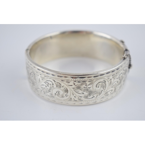 225 - Heavy wide silver bangle, 60.4 grams, Birmingham 1959.