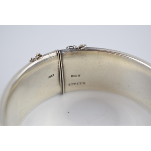 225 - Heavy wide silver bangle, 60.4 grams, Birmingham 1959.