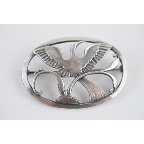 229 - A Georg Jensen silver brooch, designed by Arno Malinowski. 'Bird of Paradise' with stylized leaves w... 