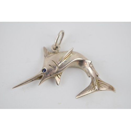 231 - Silver pendant in the form of a swordfish, with sapphire eye, 12.6 grams, 4cm wide.