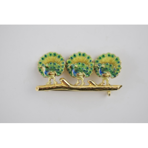 236 - 18ct gold brooch in the form of three peacocks, on a branch, with enamelled decoration, 35mm wide, 5... 