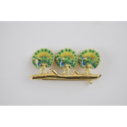 236 - 18ct gold brooch in the form of three peacocks, on a branch, with enamelled decoration, 35mm wide, 5... 