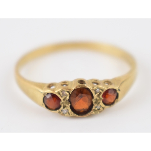 246 - 9ct gold diamond and garnet ring, 2.0 grams, size T.