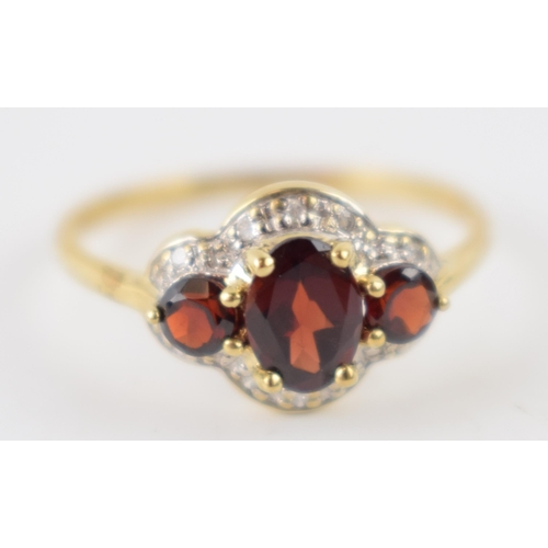 247 - 9ct gold garnet and diamond ring, 1.9 grams, size S.