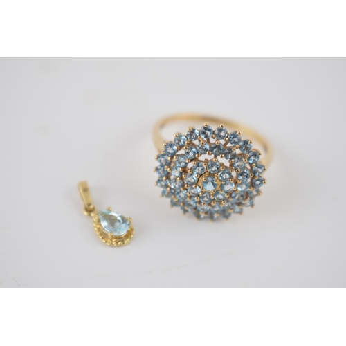 252 - 9ct gold ring set with light blue stones together with a matching pendant, 3.8 grams (2).